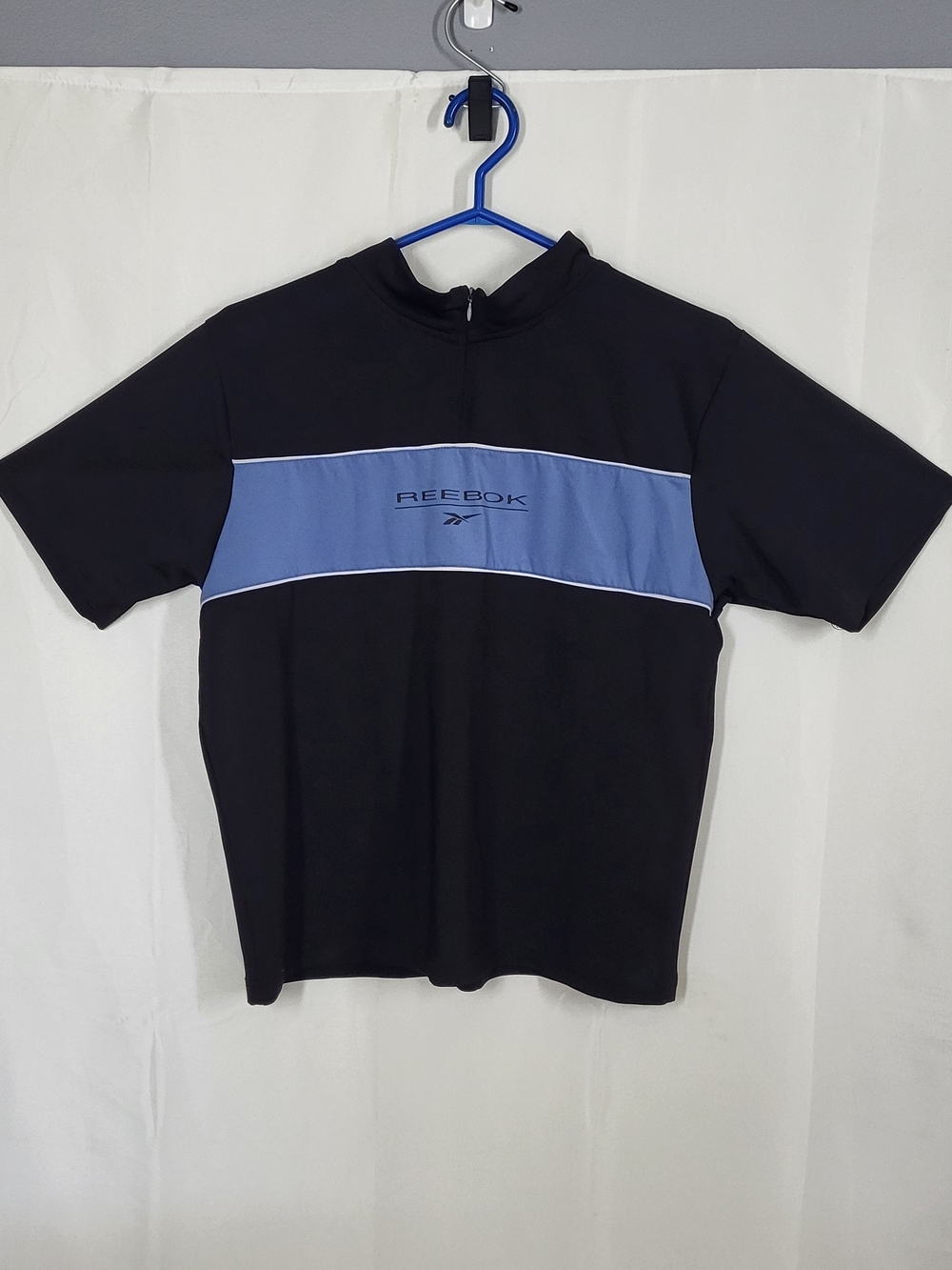 Reebok Men’s Black Polo with Blue Chest Panel